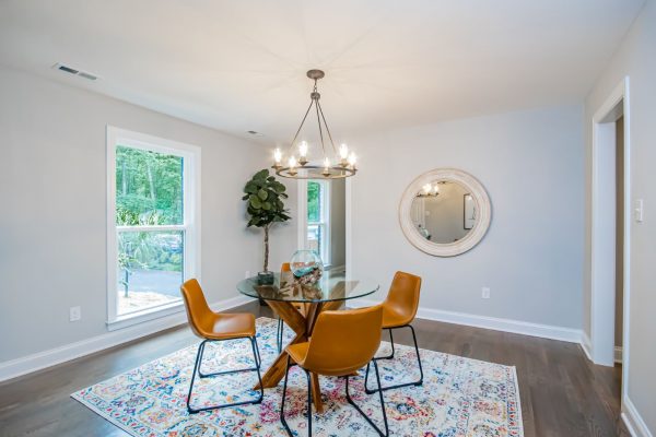 Dining room of renovated ranch home on Lake Cherokee by Richmond Hill Design-Build