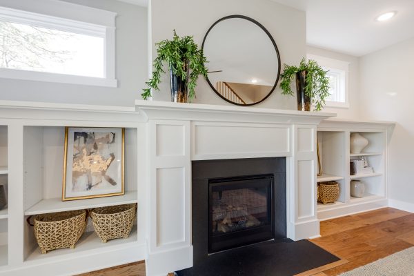 Built-ins by fireplace in family room of new home built by Richmond Hill Design-Build