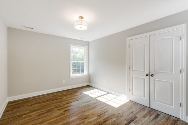 Guest bedroom in renovated home by Richmond Hill Design-Build