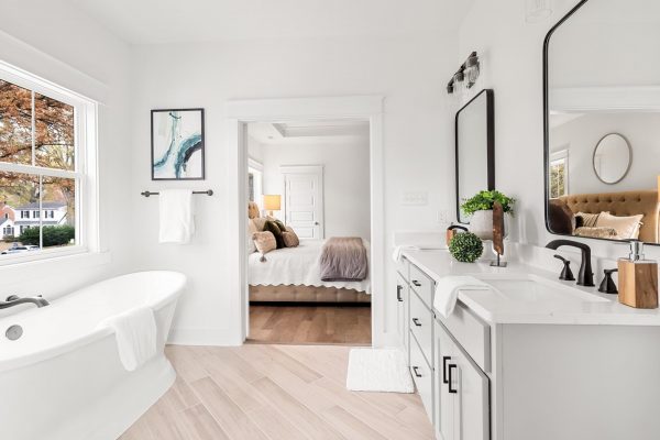 Freestanding tub in primary bathroom in new home by Richmond Hill Design-Build