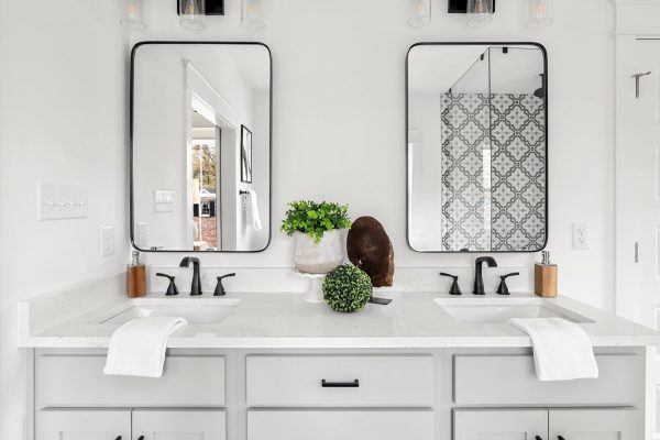 Double vanity in primary bathroom in new home by Richmond Hill Design-Build