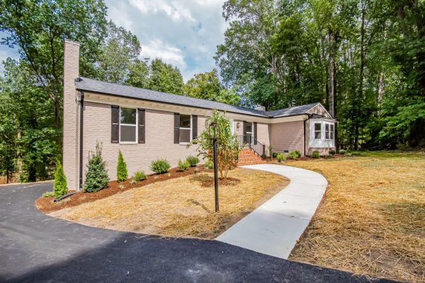 Stunning exterior of renovated ranch home on Lake Cherokee by Richmond Hill Design-Build