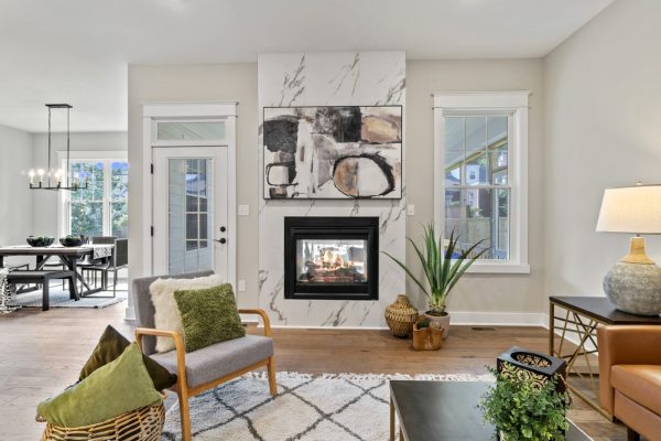 Family room with fireplace in new home by Richmond Hill Design-Build