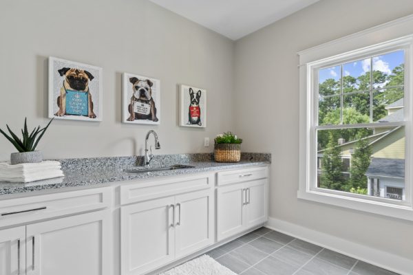 Laundry room in new home by Richmond Hill Design-Build