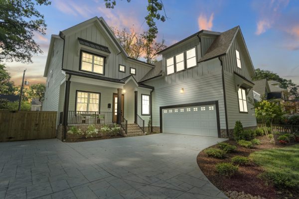 Twilight photo of stunning exterior of new home by Richmond Hill Design-Build