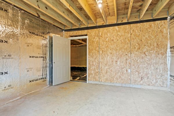 Unfinished storage area on ground floor of new build by Richmond Hill Design-Build