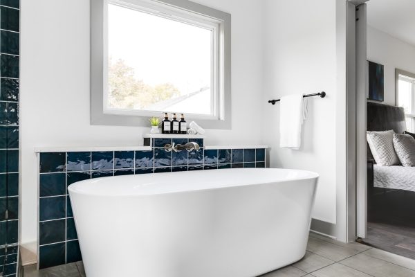 Freestanding tub in primary bathroom in new home by Richmond Hill Design-Build