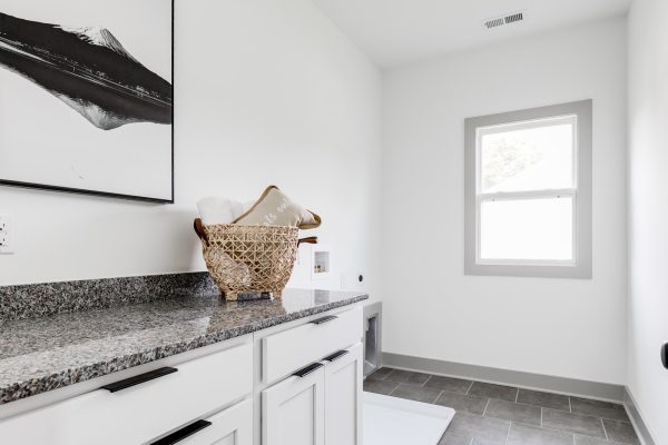 Laundry room in new home by Richmond Hill Design-Build