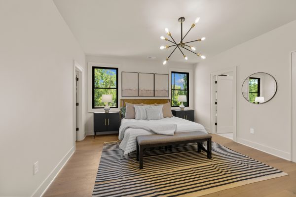 Primary bedroom in stunning new home built by Richmond Hill Design-Build