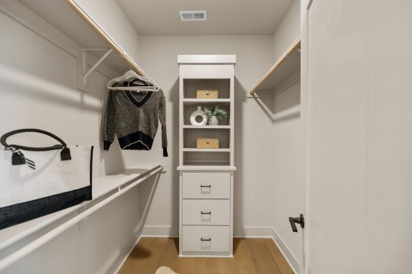 Closet in primary bedroom in stunning new home built by Richmond Hill Design-Build