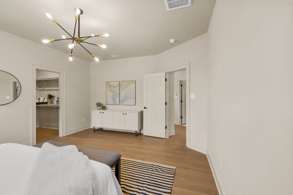 Primary bedroom in stunning new home built by Richmond Hill Design-Build